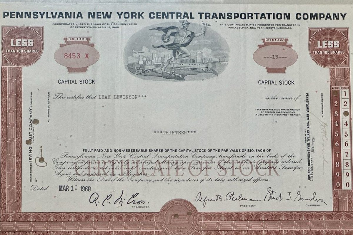 A framed historical share certificate representing part ownership of a listed company